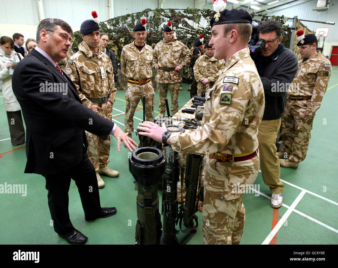 Defence Secretary Bob Ainsworth meets soldier Andrew Turner, from Newcastle, (right) from the Second Fusilier guards, at their barracks in Hounslow. Stock Photo