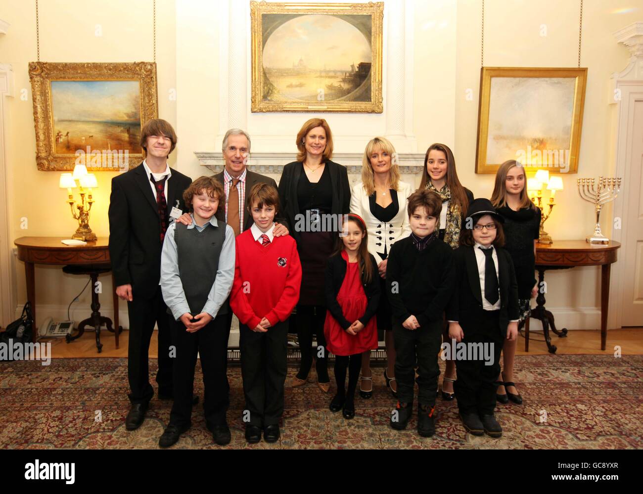 (Back row, left to right) Barney Cox, Henry Winkler, Sarah Brown, Nicky Cox, Bethany Cox, Daisy Cox (front row, left to right) Ben Hunter, Ryan King, Liberty Cox, Isaac Lyons and Evie Lyons pose for a photograph at the launch of the First News My Way! campaign, a scheme to help children with special educational needs, in Downing Street, London. Stock Photo