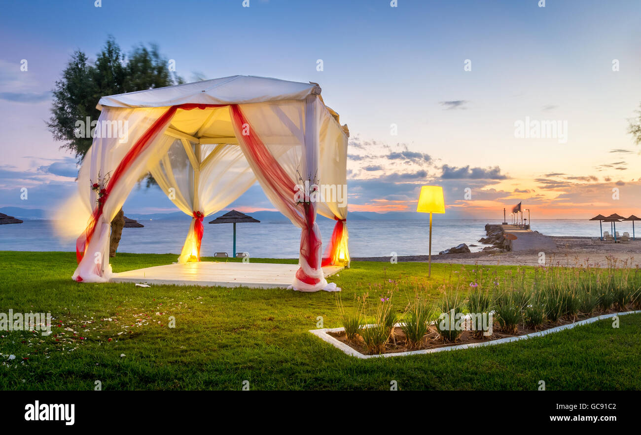 Wedding altar on greek shore at sunrise Stock Photo