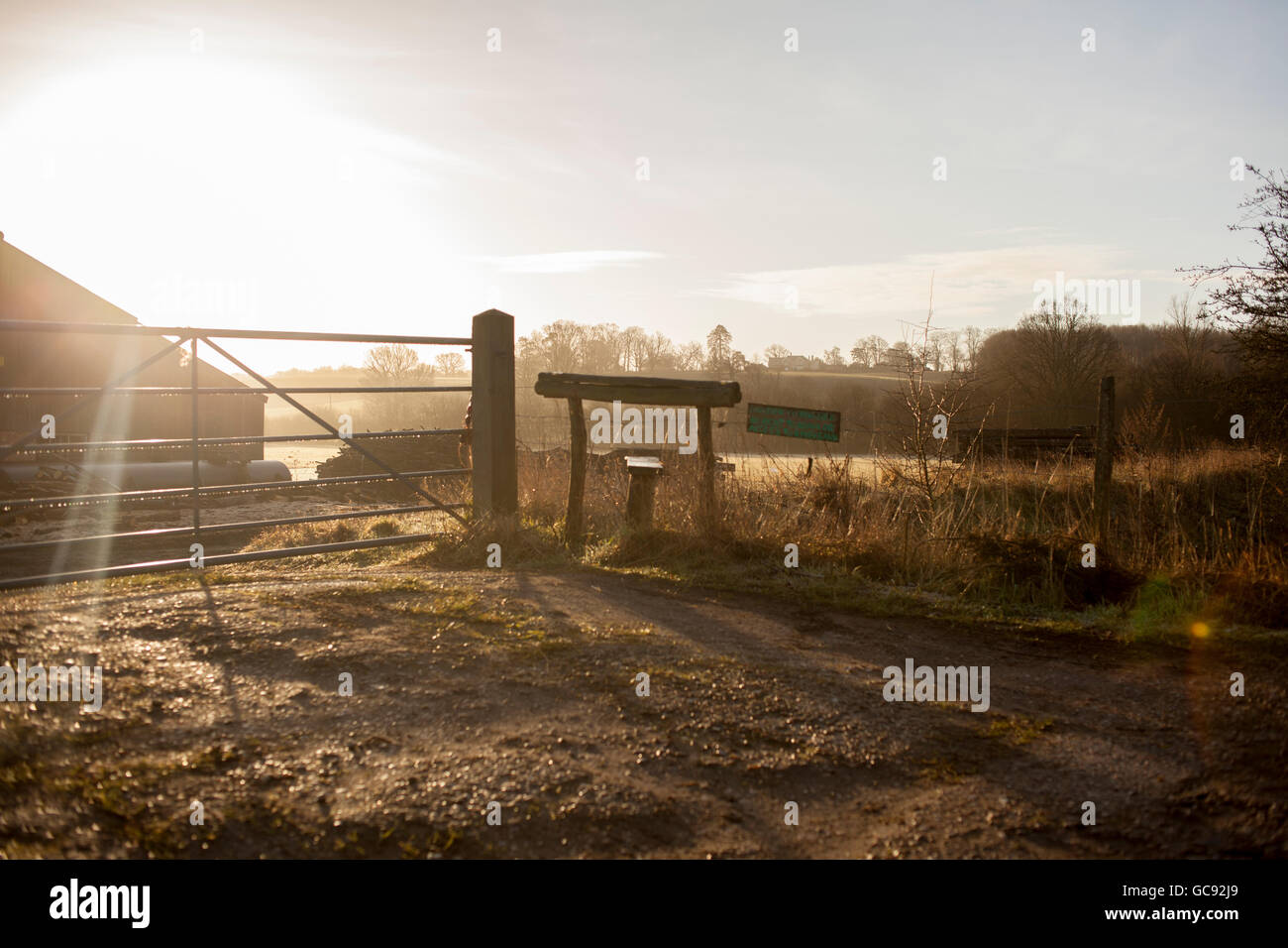 Early morning sunrise over a farm buidlng Stock Photo