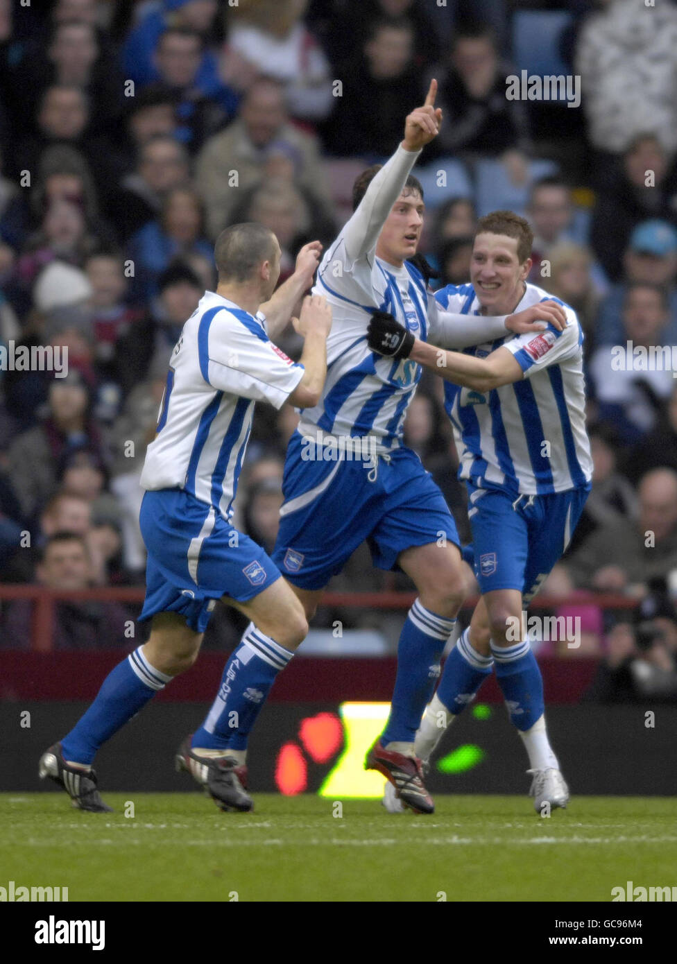 Brighton and Hove Albion's Tommy Elphick(centre) celebrates after scoring their first and equalising goal during the FA Cup Fouth Round match at Villa Park, Birmingham. Stock Photo