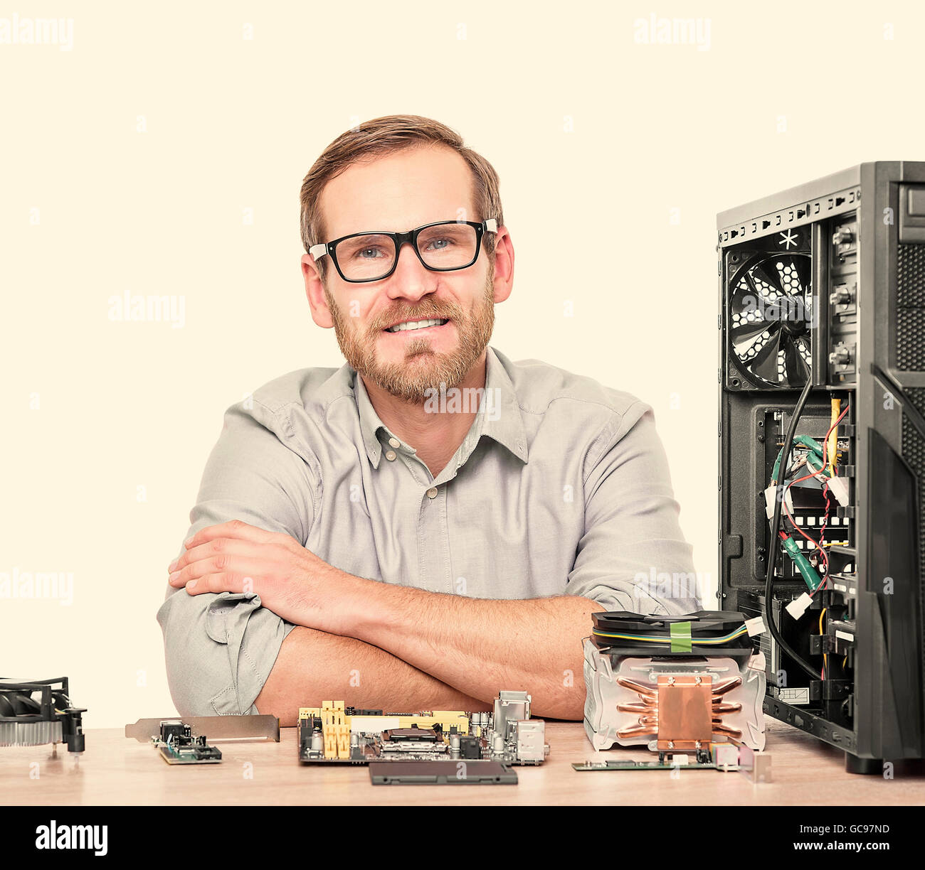 Master of computers. Engineer assembling computers in the workplace