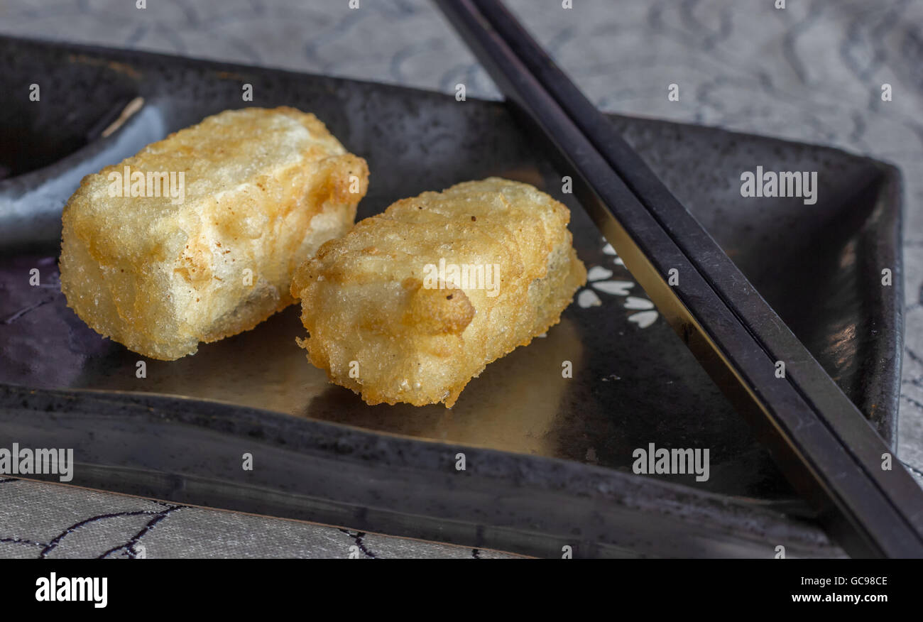 Fried Japanese tofu in tempura with chopsticks Stock Photo Alamy