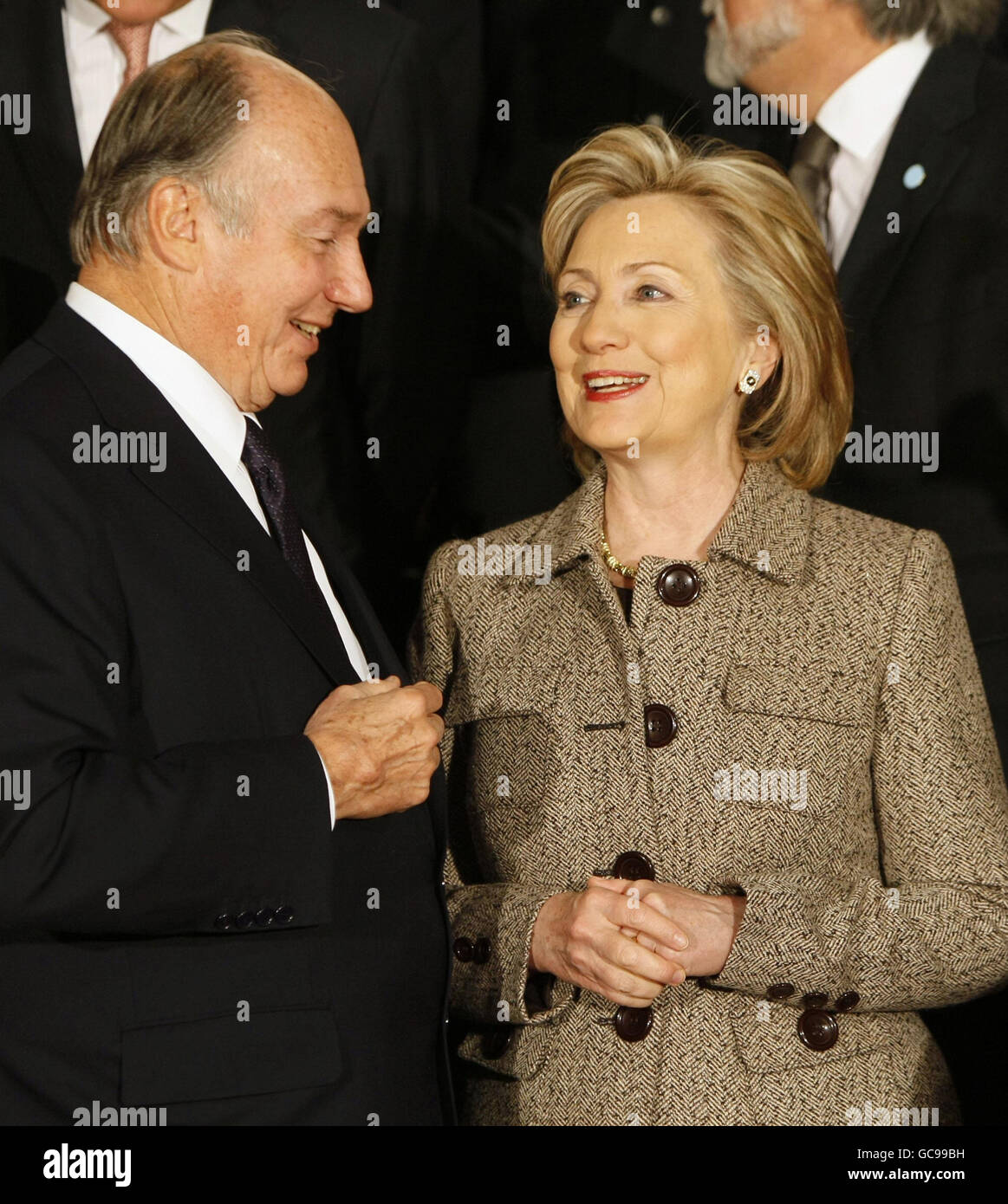 U.S. secretary of State Hillary Clinton (right) speaks with the Aga Khan (left) prior to a group photo at the Afghanistan Conference at Lancaster House in London. Stock Photo