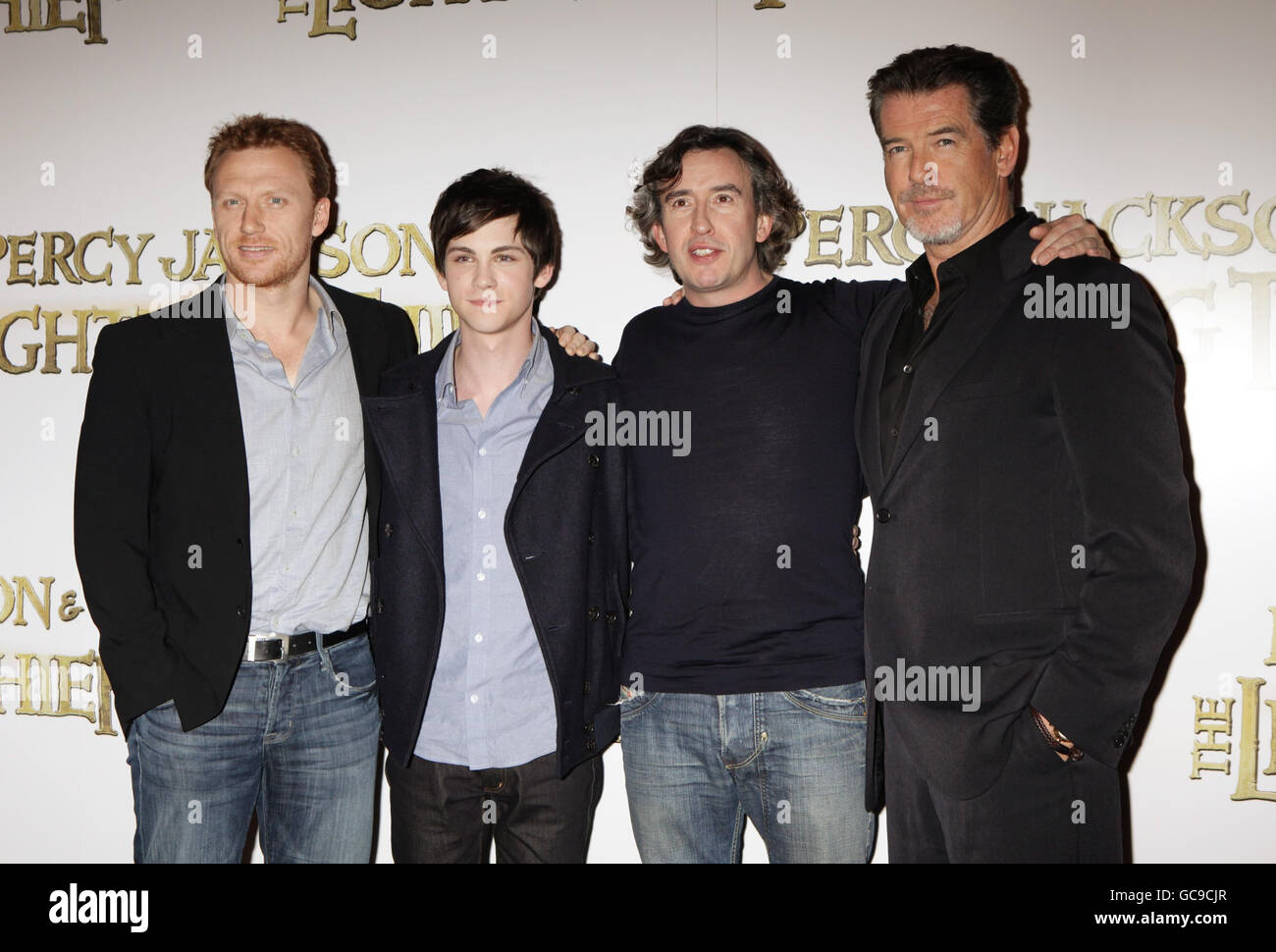 The cast of the film (left to right) Kevin McKidd, Logan Lerman, Steve Coogan and Pierce Brosnan during a photocall for the film Percy Jackson and the Lightning Thief, at the Dorchester Hotel in central London. Stock Photo