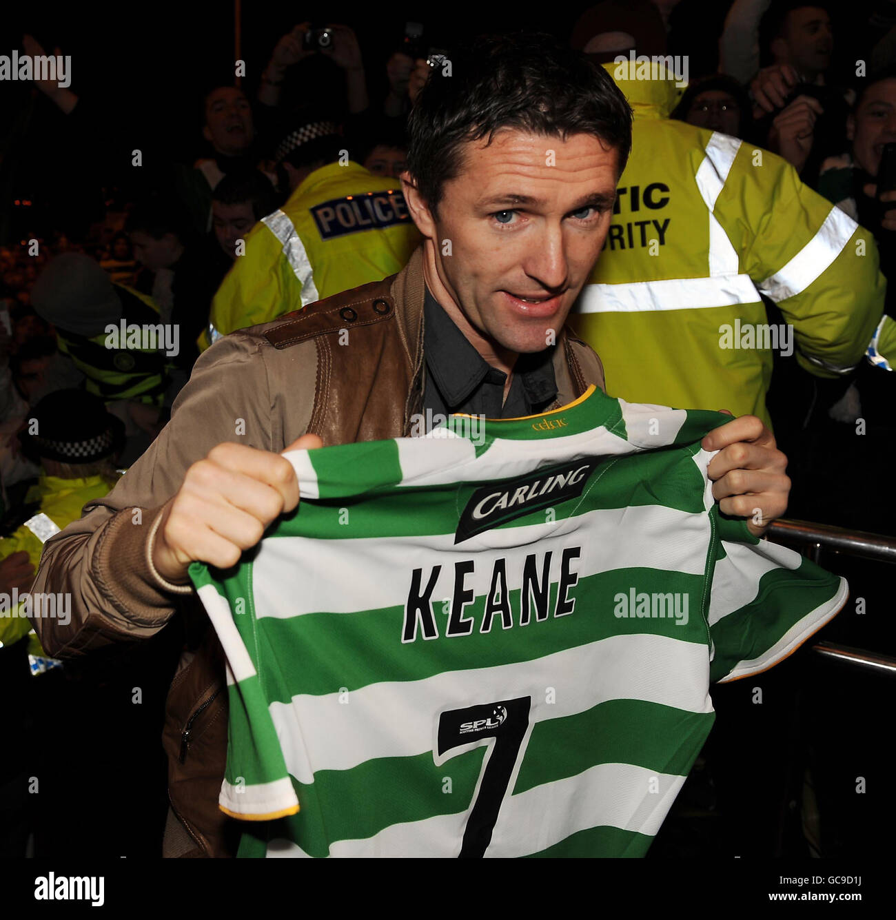 Celtic's new loan signing Robbie Keane with his shirt as he greets waiting fans at Celtic Park, Glasgow. Stock Photo