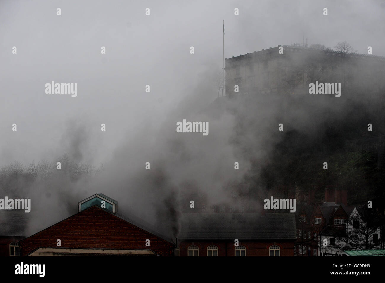 Nottingham Castle is shrouded in smoke from a fire in Nottingham city centre where an electricity substation fire has put over 2000 homes and businesses in Nottingham without electricity. Stock Photo