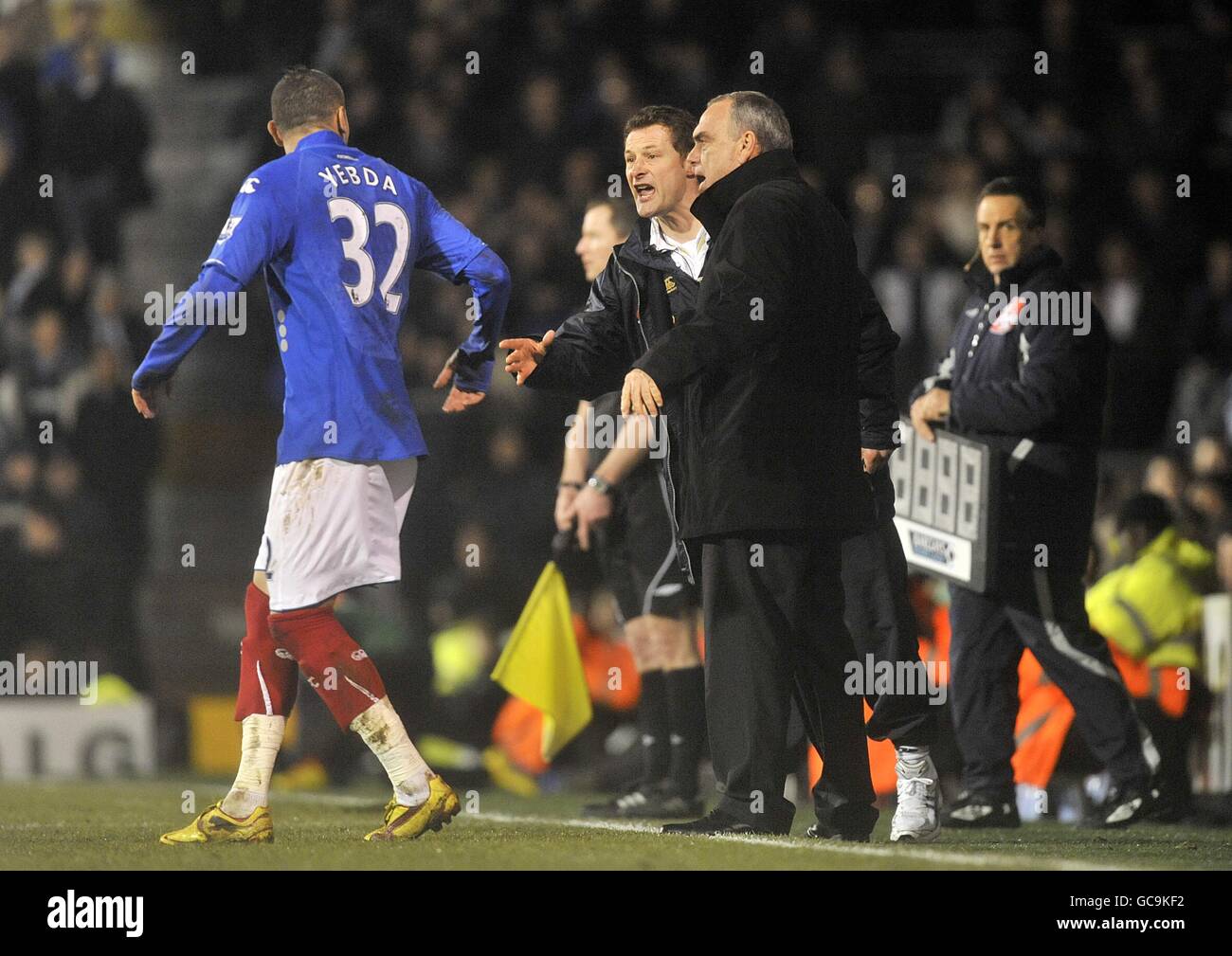 Portsmouth manager Avram Grant gives instructions to Hassan Yebda on the touchline. Stock Photo