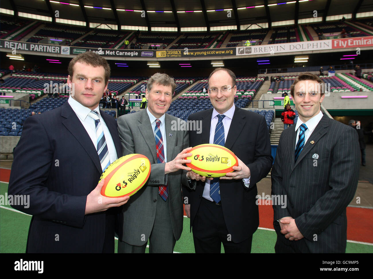 Scotland's Geoff Cross (far left) and Mike Blair (far right) join their country's Justice Secretary Kenny MacAskill (centre left) and SRU Chief Executive Gordon McKie (centre right) to promote CashBack for Communities Initative. Stock Photo