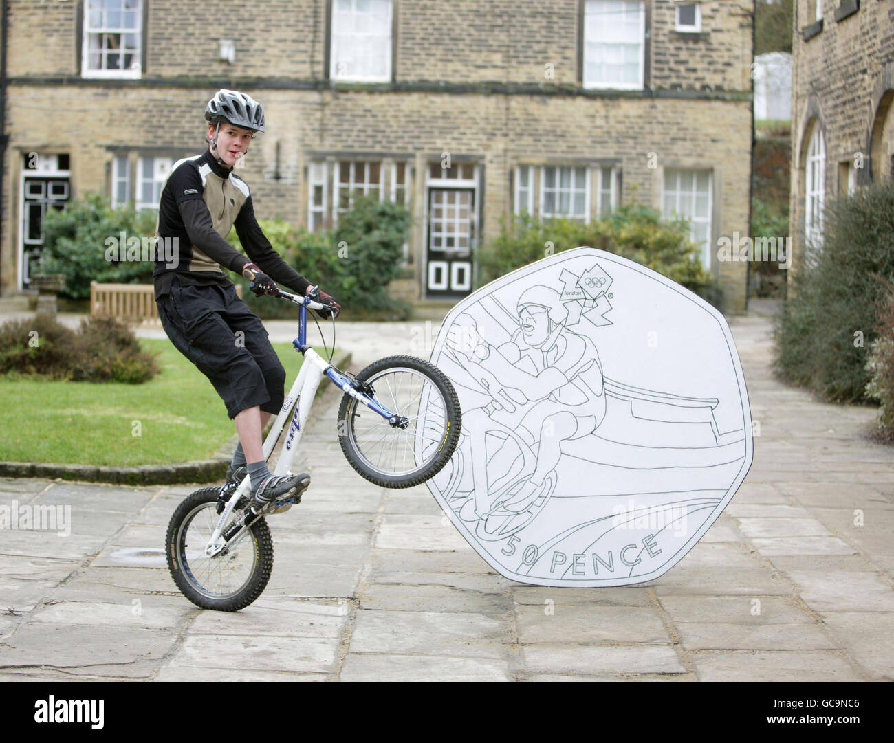 Theo CrutchleyMack, 16 from Halifax, poses on his bike beside a giant