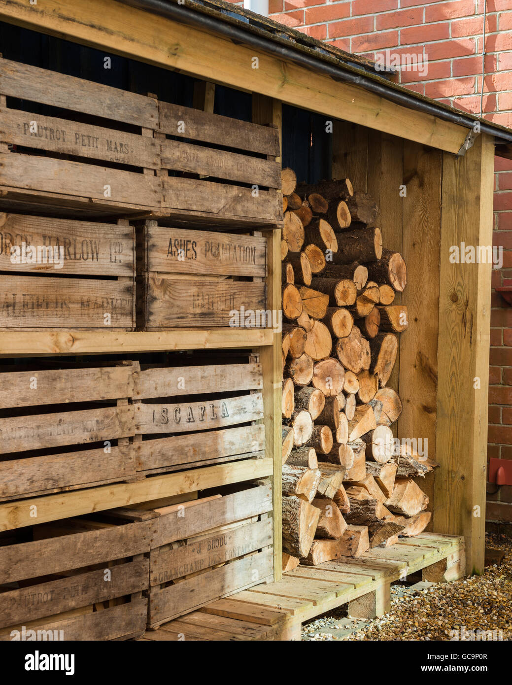 Outside log store complete with vintage fruit crates Stock Photo