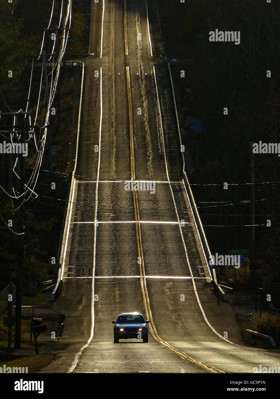 Cars driving up and down large hill Columbia County New York Stock