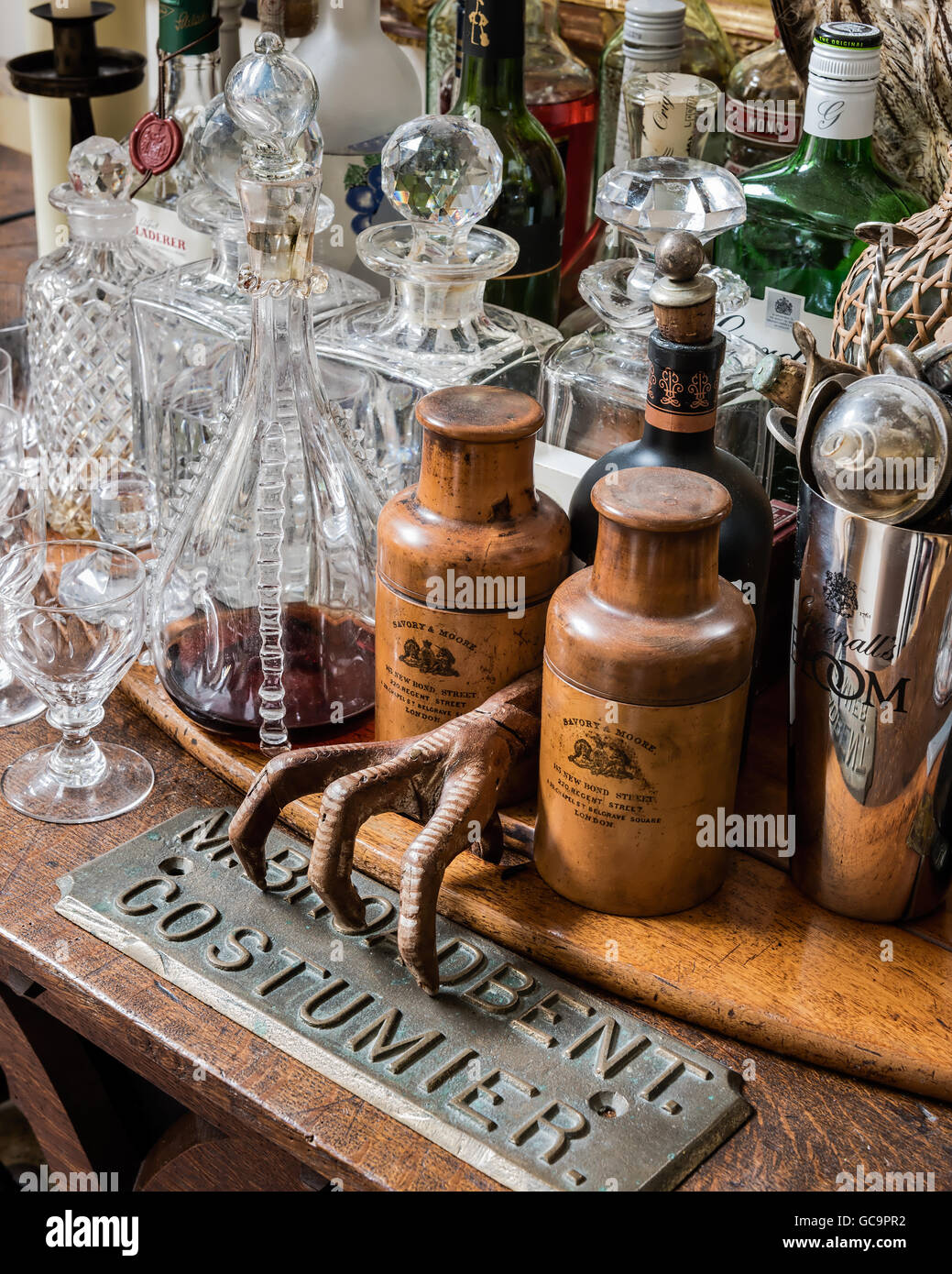 Antique homeware with metal sign and decanters in London apartment, UK Stock Photo