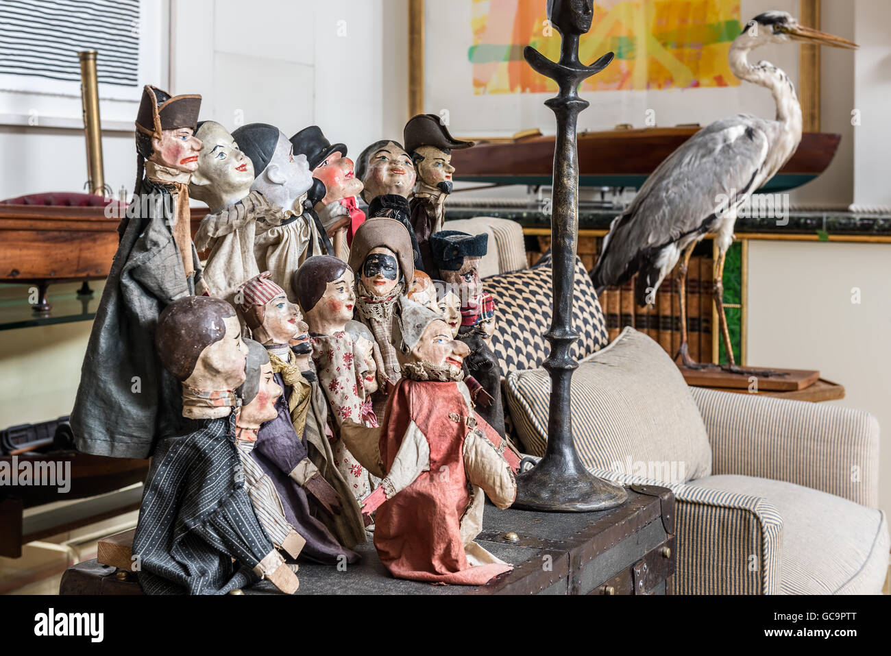 19th and 20th century papier-mache French puppets in London apartment filled with curios Stock Photo