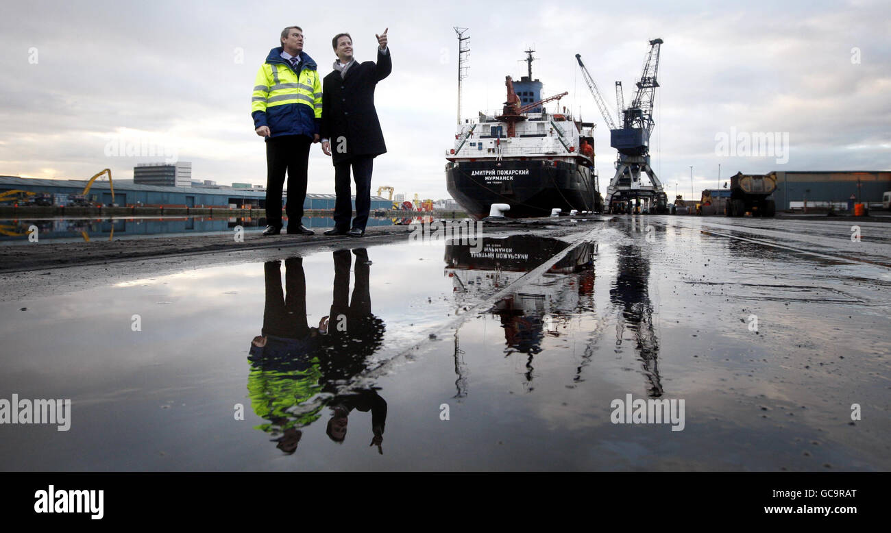 Liberal Democrat leader Nick Clegg (right) chats to Doug Coleman, Project Director Forth Ports, during a visit to Forth Ports in Edinburgh to promote plans to create 57,000 jobs by upgrading disused shipyards. Stock Photo