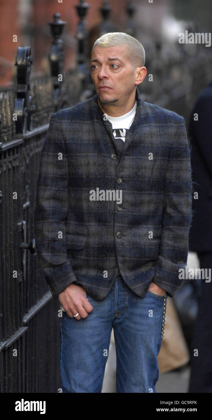 An unidentified man believed to be a friend of Alexander McQueen, outside  McQueen's flat in central London Stock Photo - Alamy