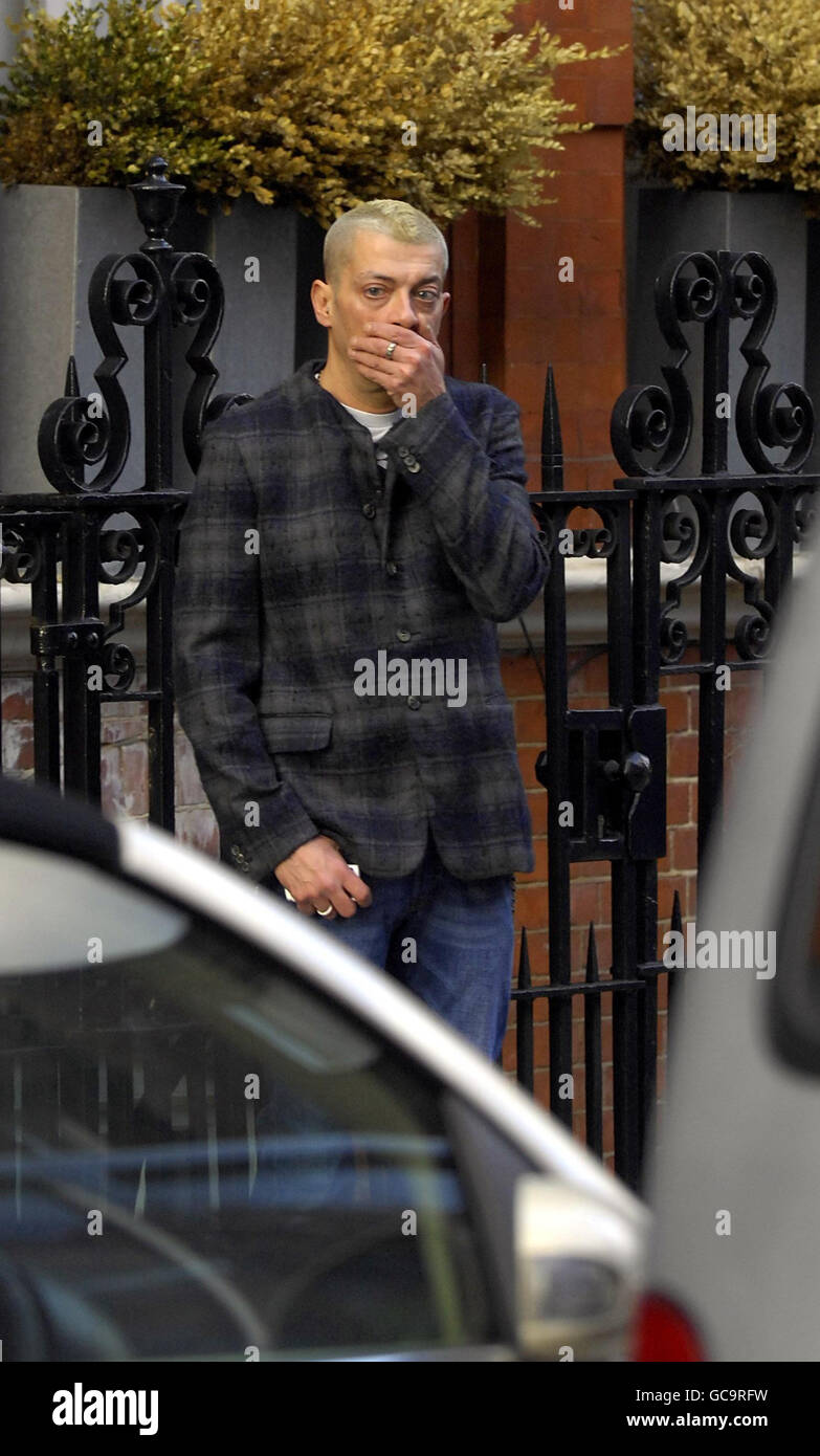 An unidentified man believed to be a friend of Alexander McQueen, outside  McQueen's flat in central London Stock Photo - Alamy