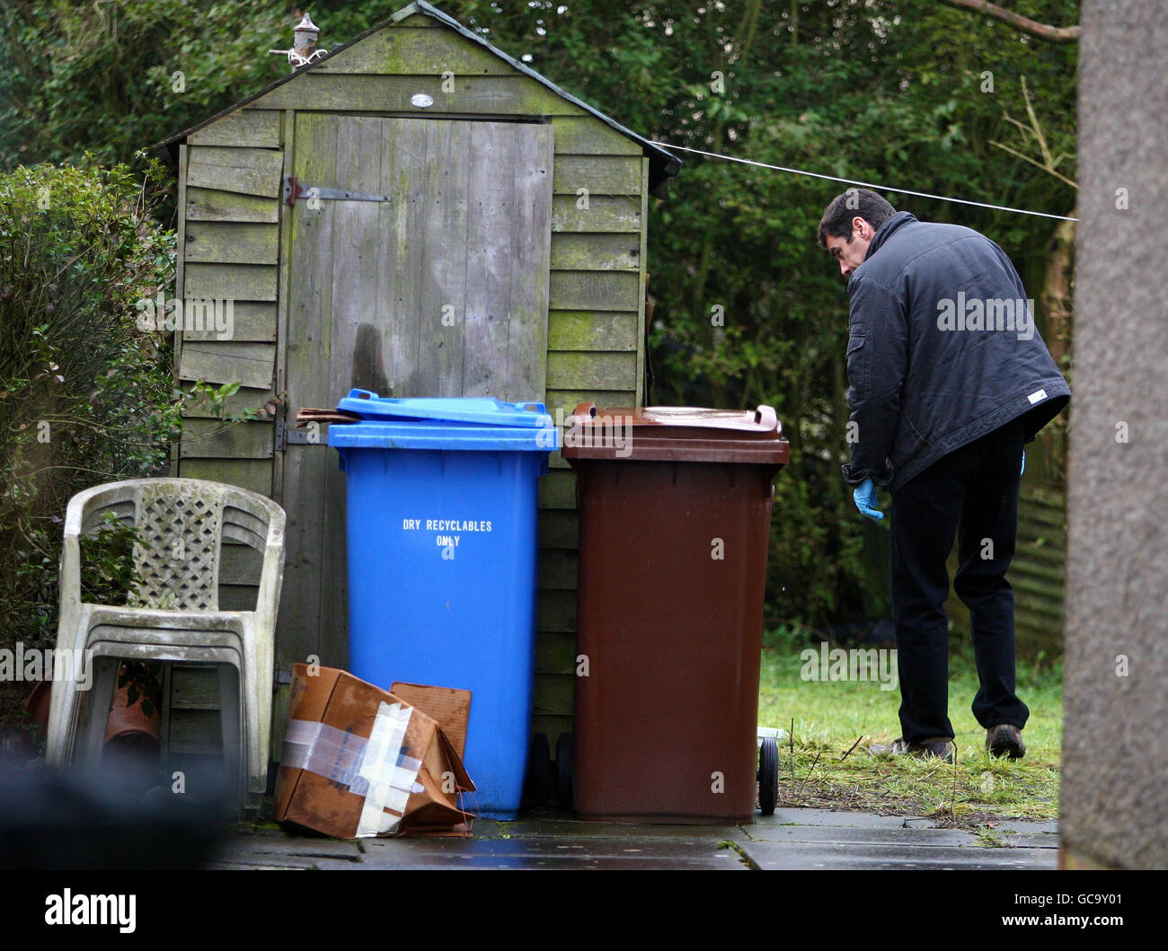 A Lothian and Borders Police Scientific Support Unit member (name not known) checks the back garden of Susan Boyle's home in Blackburn, West Lothian. The singer returned home to find an intruder inside her house after she returned from London on Tuesday night where she had been helping to record the Helping Haiti single. Stock Photo