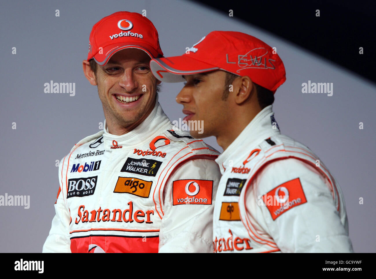 McLaren Mercedes drivers Jenson Button and Lewis Hamilton during the launch  of the Vodafone McLaren Mercedes MP4-25 F1 Car at the McLaren Mercedes team  headquarters, Newbury Stock Photo - Alamy