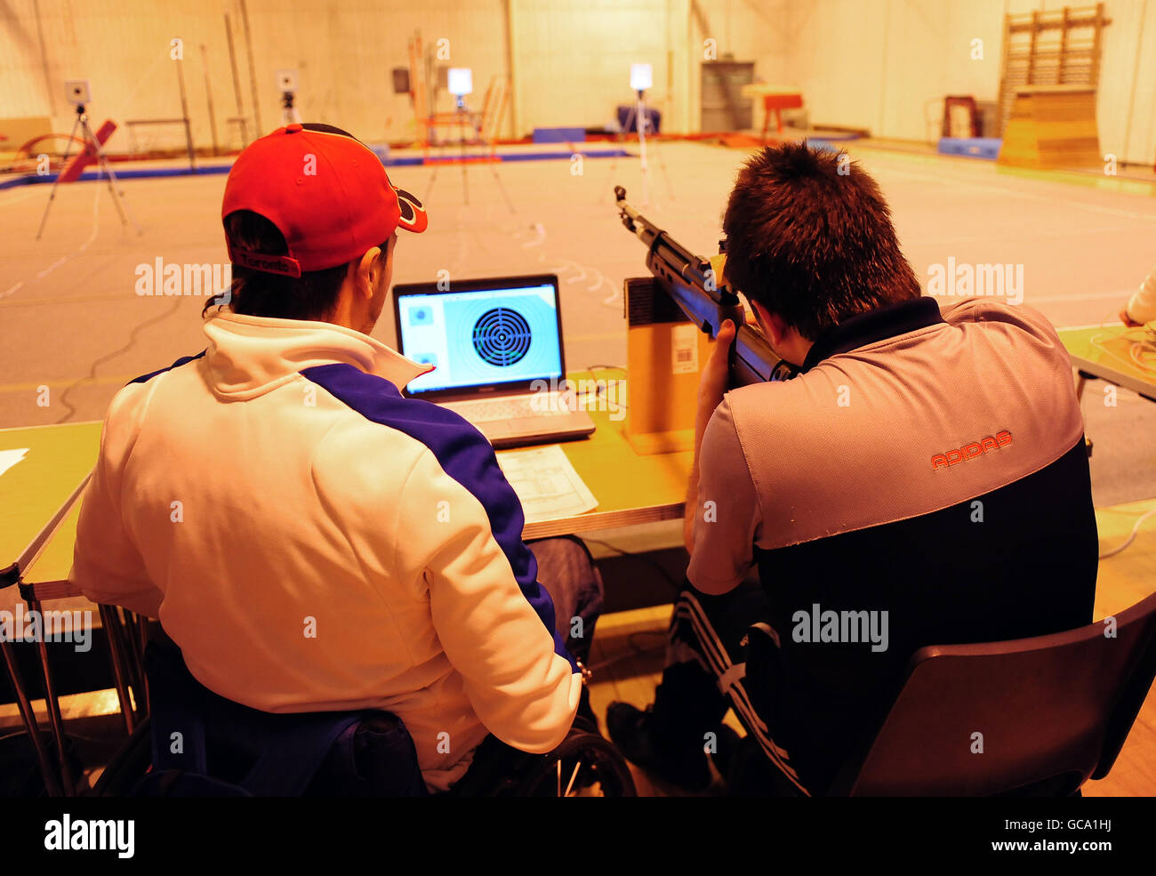 Press Association Journalist Alex Brooker (right) takes part in the Shooting part of the ParalympicsGB London 2012 talent assessment day with Great Britian's Matt Skelhon (left) at the Munrow Sports Centre at the University of Birmingham Stock Photo