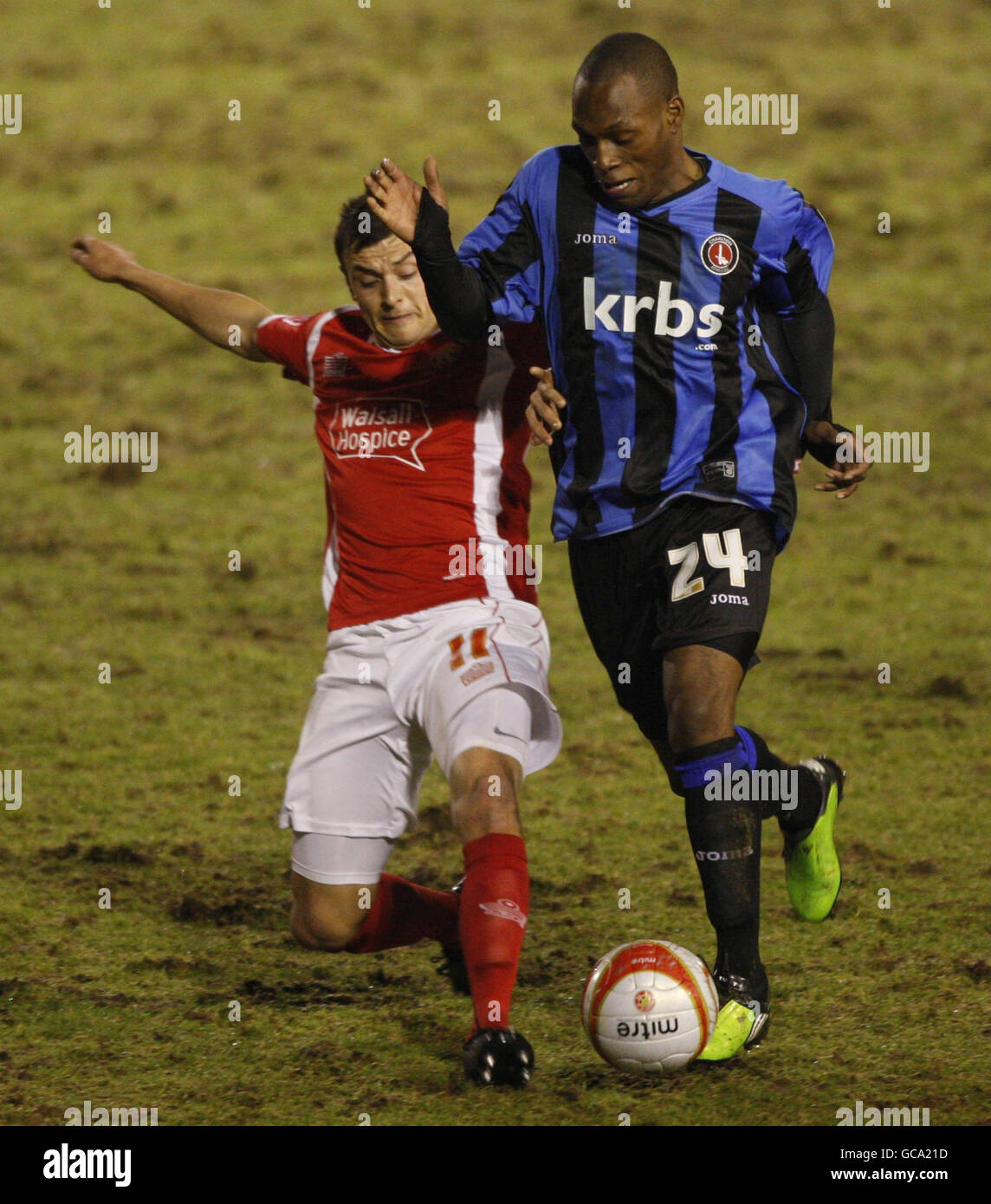 Charlton Athletic's Kyel Reid tussles for ball with Walsall defender Alex Nicholls during the Coca-Cola Football League One match at the Banks Stadium, Walsall. Stock Photo