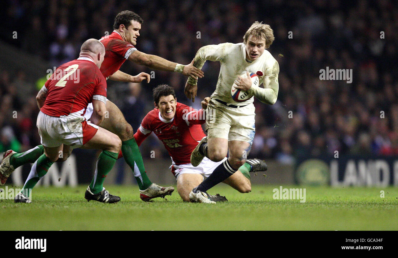 England's Matthew Tait tries to break away from Wales' Jamie Roberts and James Hook during the RBS 6 Nations match at Twickenham, London. Stock Photo