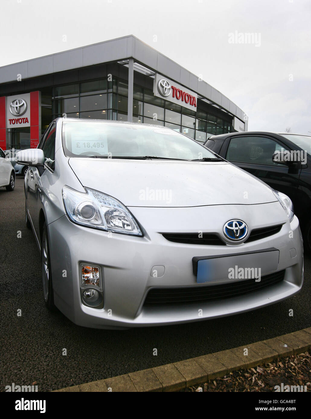 Toyota prius hybrid car on forecourt toyota dealer in ashford hires