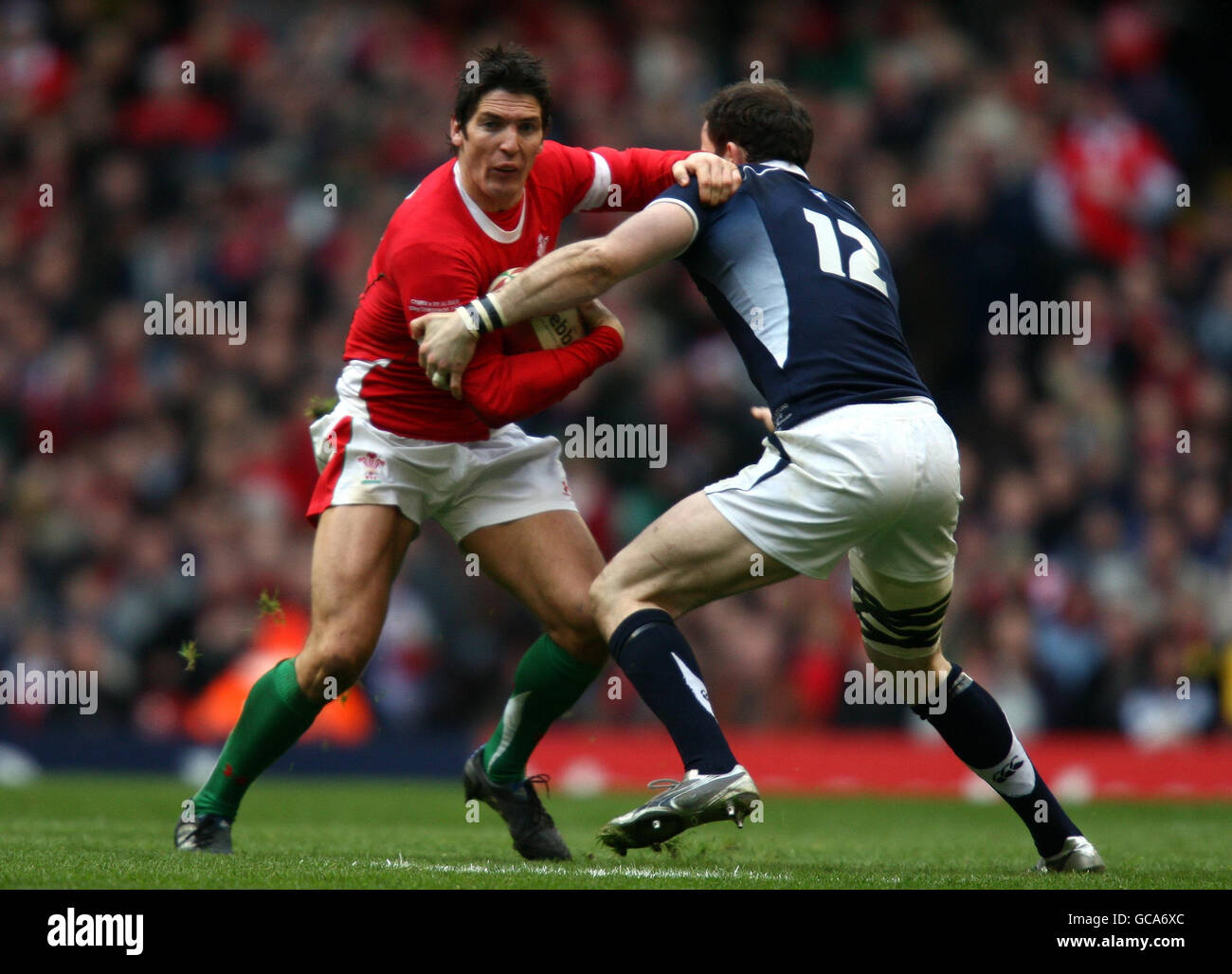 Wales James Hook Hands Off Scotland s Graeme Morrison During The RBS 6 wales-james-hook-hands-off-scotland-s-graeme-morrison-during-the-rbs-6