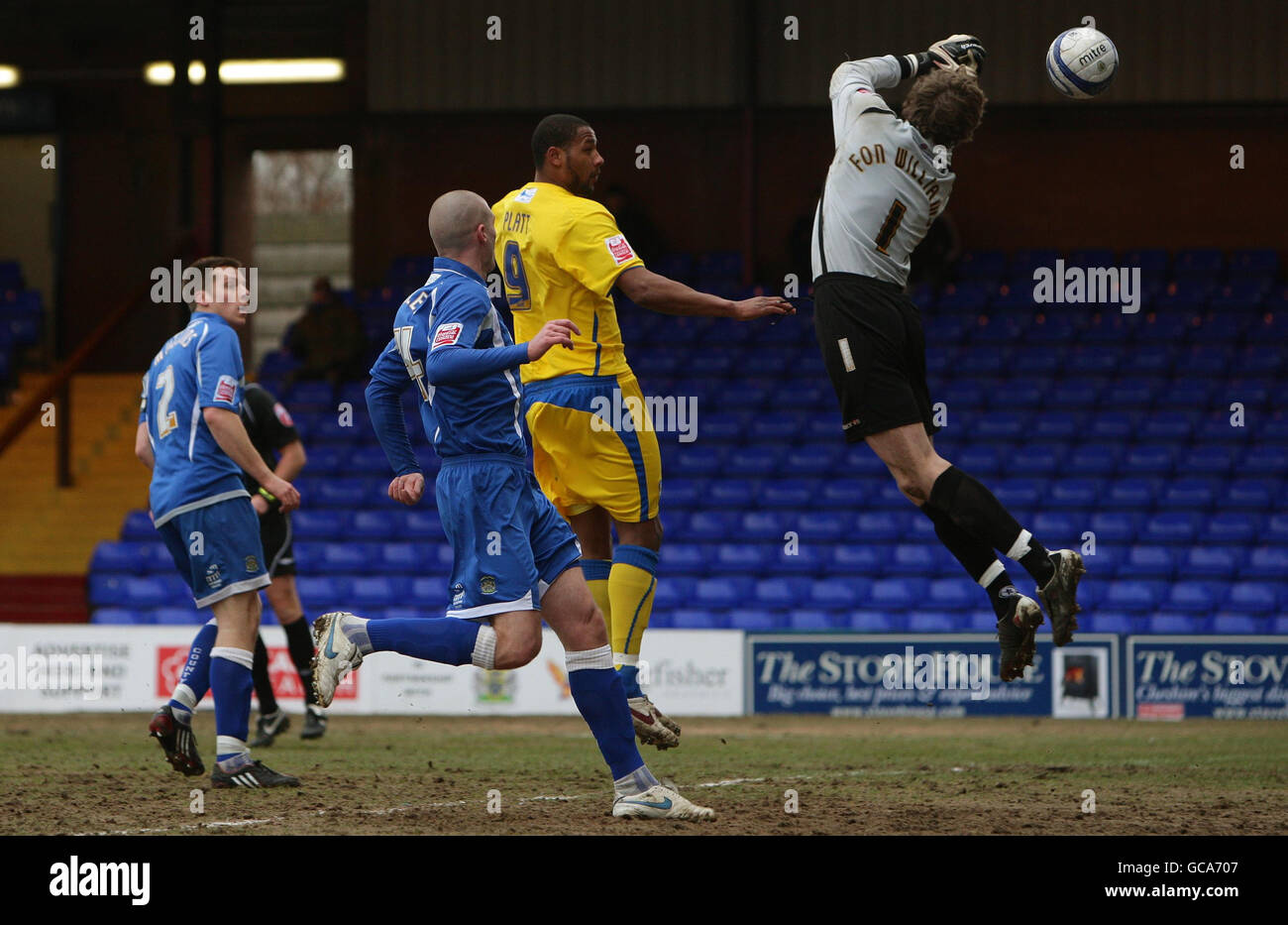 Stockport County's goalkeeper Owain Fon Williams drops the ball for