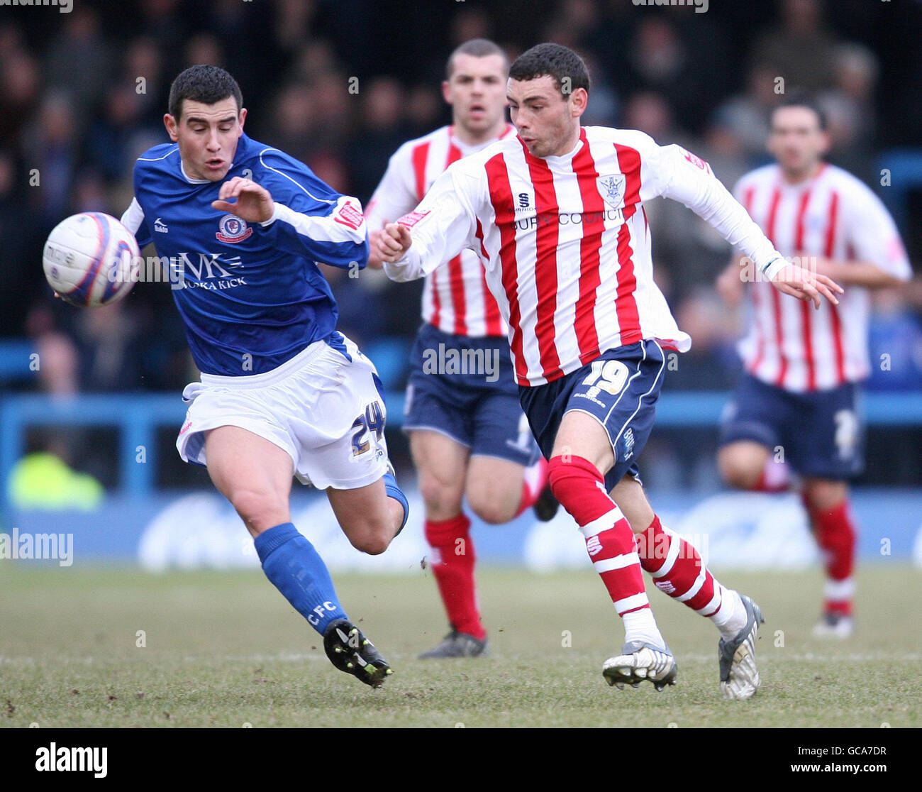Chesterfield's Adam Rundle and Bury's David Worrall battle for the ball during the Coca-Cola League Two match at the Recreation Ground, Chesterfield. Stock Photo