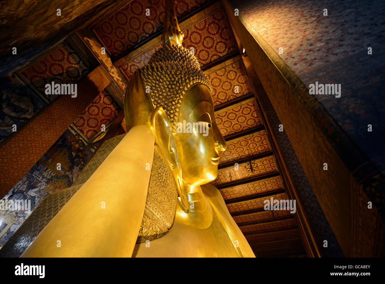 the reclining buddha in the temple of Wat Pho in the city of Bangkok in ...