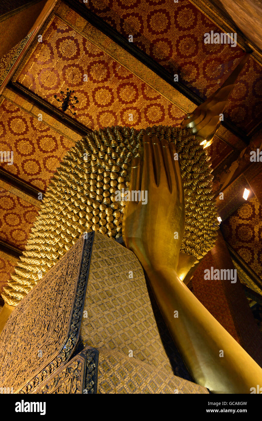 the reclining buddha in the temple of Wat Pho in the city of Bangkok in ...