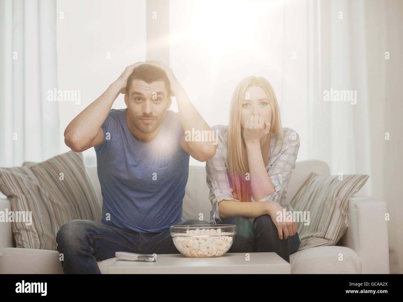 upset couple after sports team loss Stock Photo Alamy