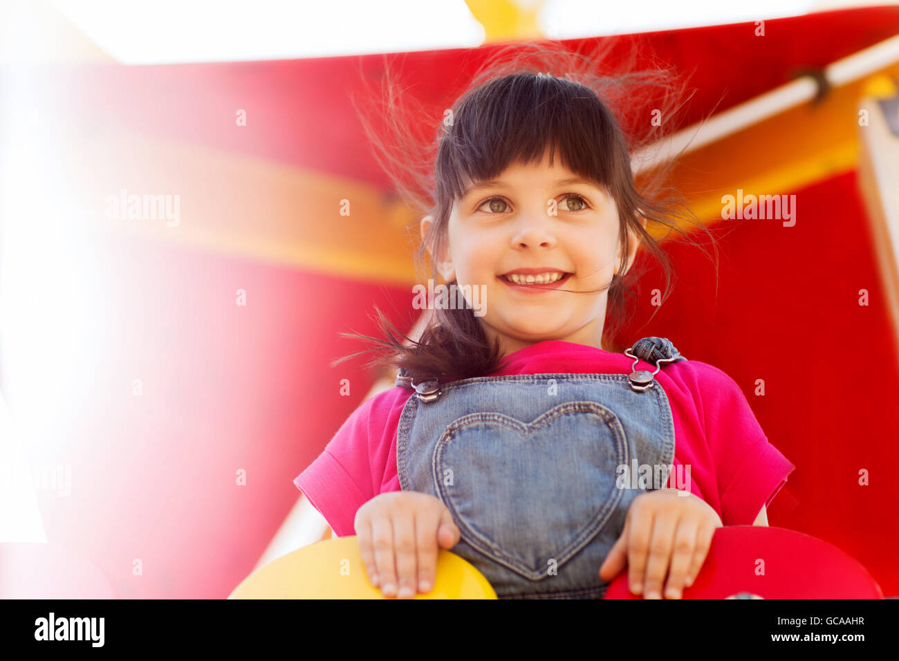 happy little girl on children playground Stock Photo - Alamy