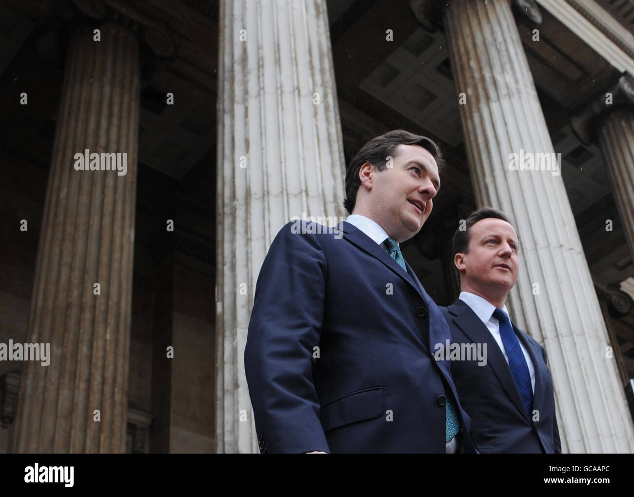 Shadow Chancellor George Osborne, with Conservative Party leader David Cameron leave the British Museum in London after the shadow chancellor spoke to business and city workers in London where he set out eight benchmarks against which voters would be able to judge a Tory government's success on the economy. Stock Photo