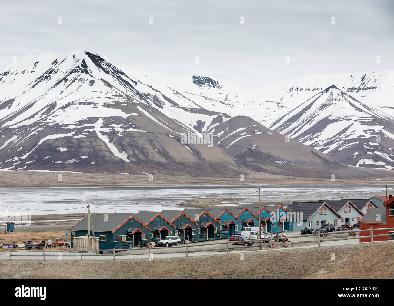 Multicolored wooden houses along Adventfjorden in Longyearbyen on Spitsbergen, Svalbard Islands, Norway Stock Photo