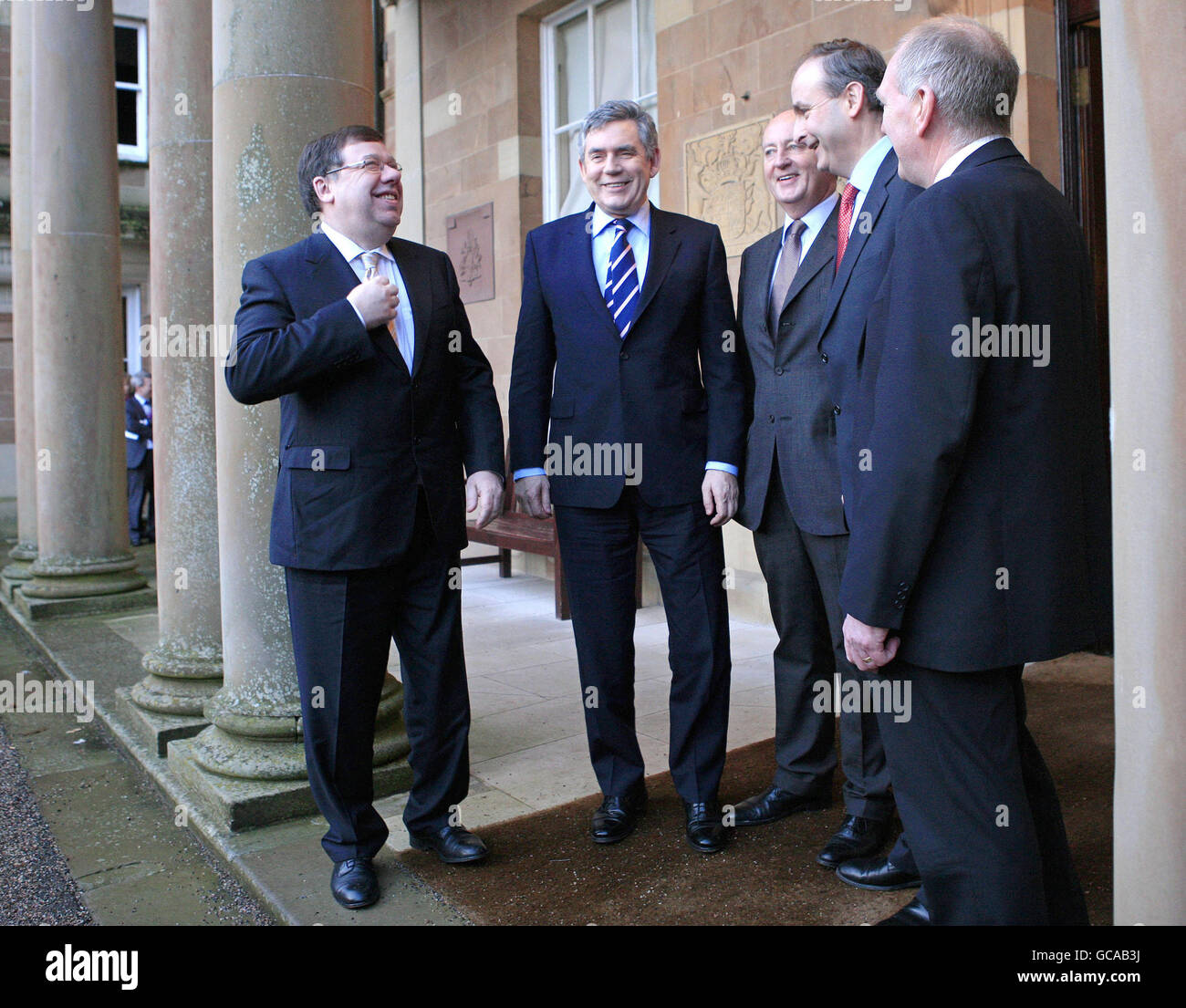 Irish Prime Minister Brian Cowen (left) and Britain's Prime Minister Gordon Brown (2nd left) are greeted by Secretary of State for Northern Ireland Shawn Woodward (3rd right), Irish Foreign Affairs Minster Michael Martin (2nd right) and Northern Ireland Security Minister Paul Goggins (right) at Hillsborough Castle in Hillsborough, Northern Ireland. Stock Photo