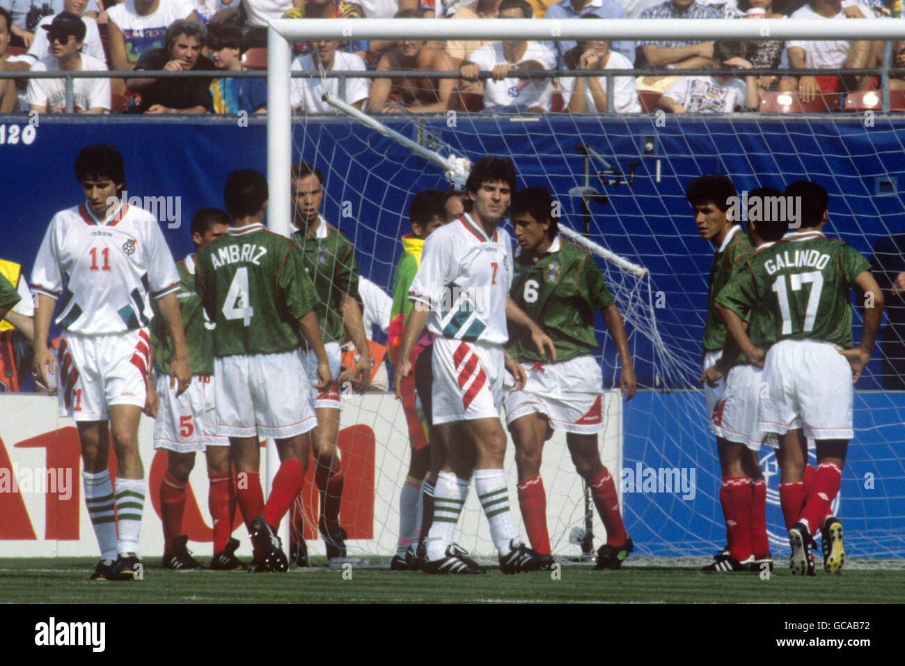 Mexico's Marcelino Bernal (9 centre) picks himself up from the goal net after falling into the goal. Mexico Goalkeeper Jorge Campos (hidden) pulls on the broken stanchion. Stock Photo