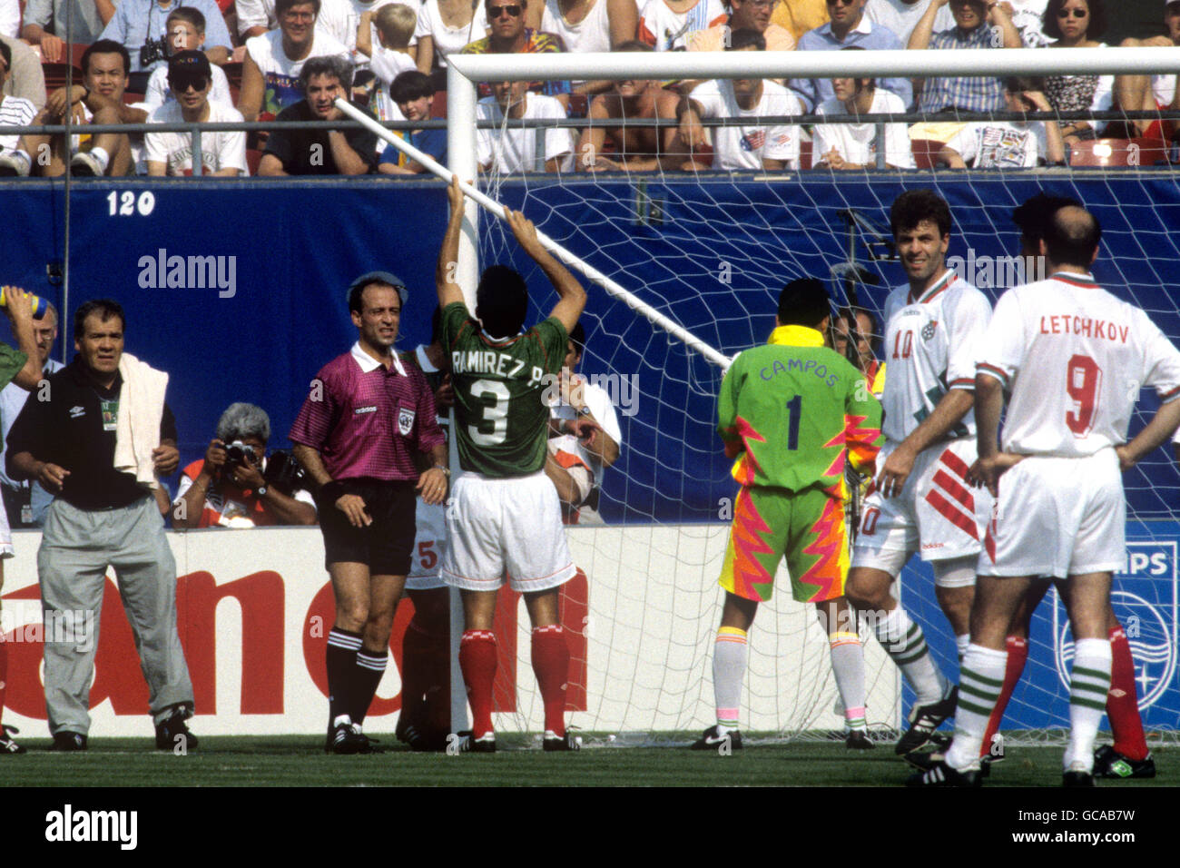 Mexico's Juan Ramirez (3) and goalkeeper Mexico Goalkeeper Jorge Campos pull on the broken stanchion after team mate Marcelino Bernal (not pictured) had fell into the net, thus breaking the goal. Stock Photo