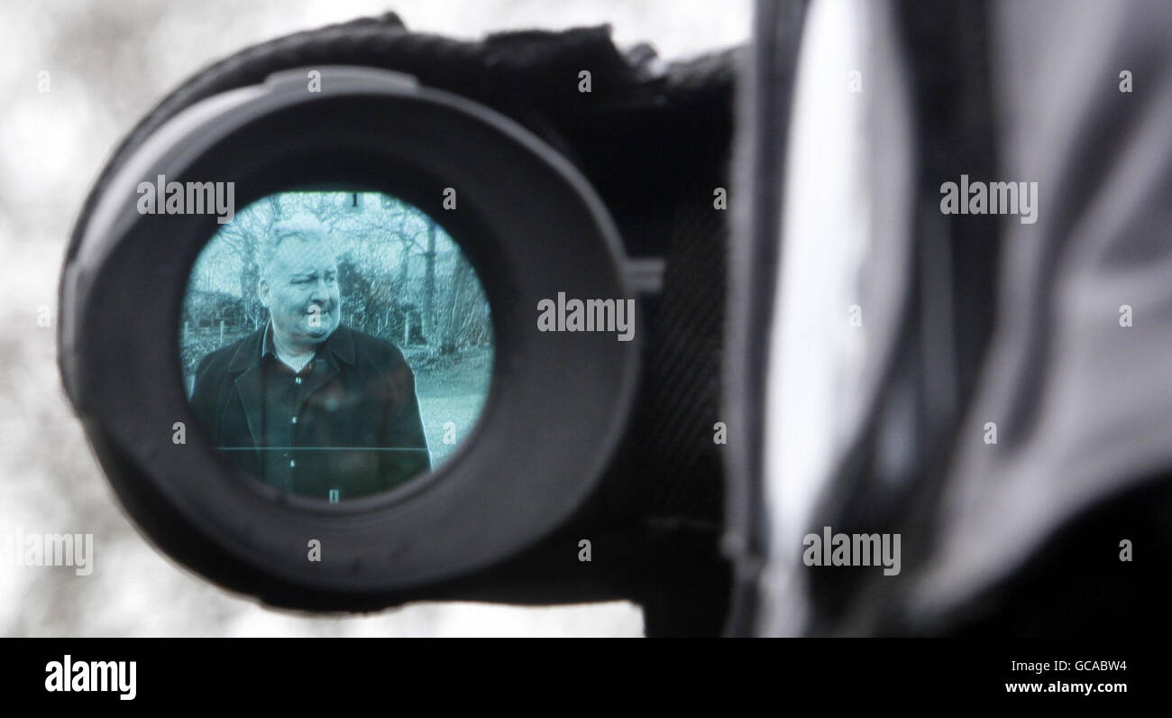 MP Jim Devine seen in a viewfinder in the back of a TV camera outside his home in Blackburn, Scotland. Stock Photo