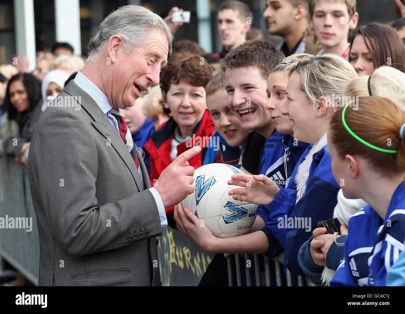 The Prince of Wales meets members of the public and students as he leaves Burnley College / University of Central Lancashire Campus in Burnley, Lancashire. Stock Photo