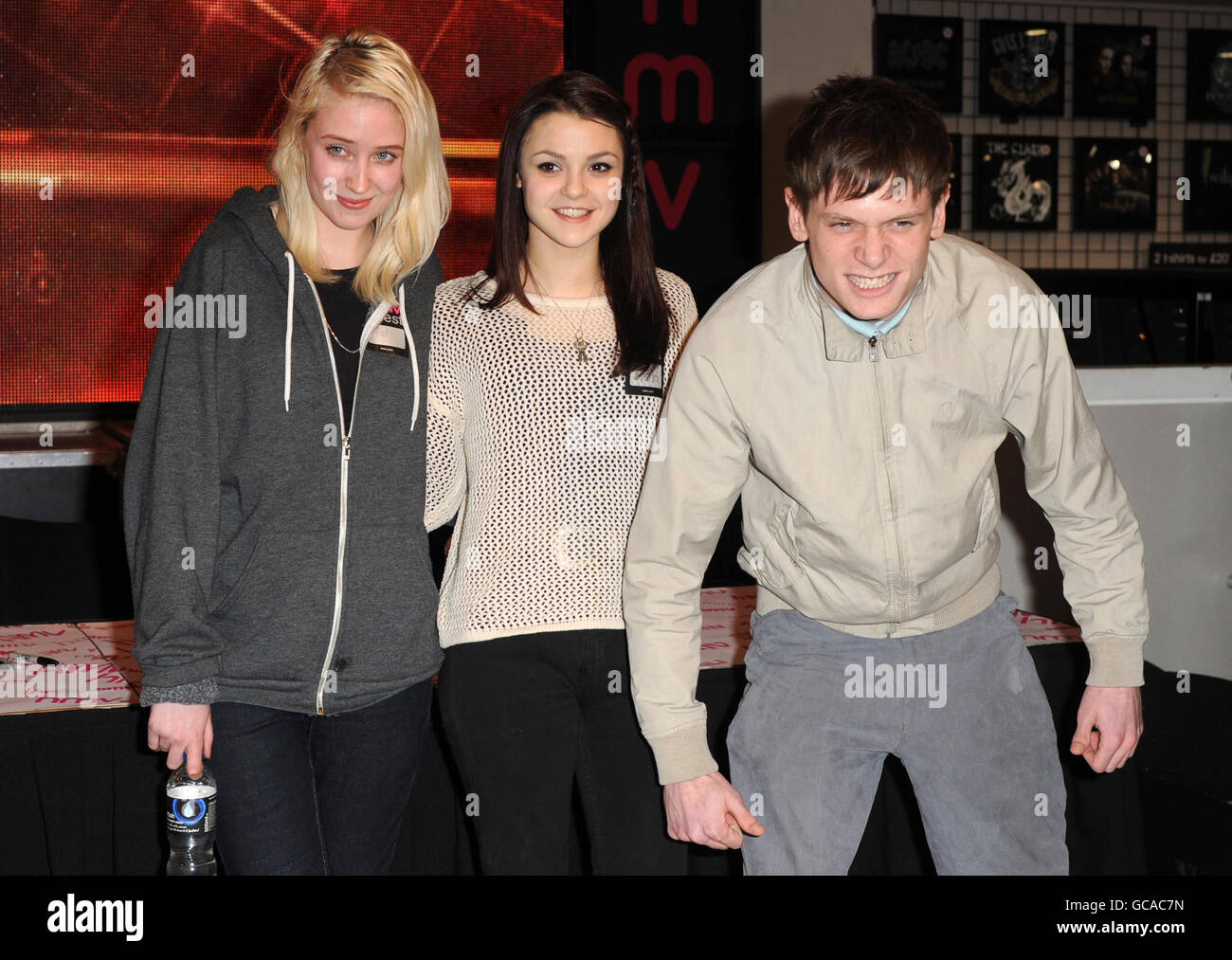 (From left to right) Lily Loveless, who plays Naomi Campbell, Kathryn Prescott, who plays Emily Fitch and Jack O'Connell, who plays James Cook in TV drama Skins, during a Skins book signing at HMV Oxford Street in central London. Stock Photo