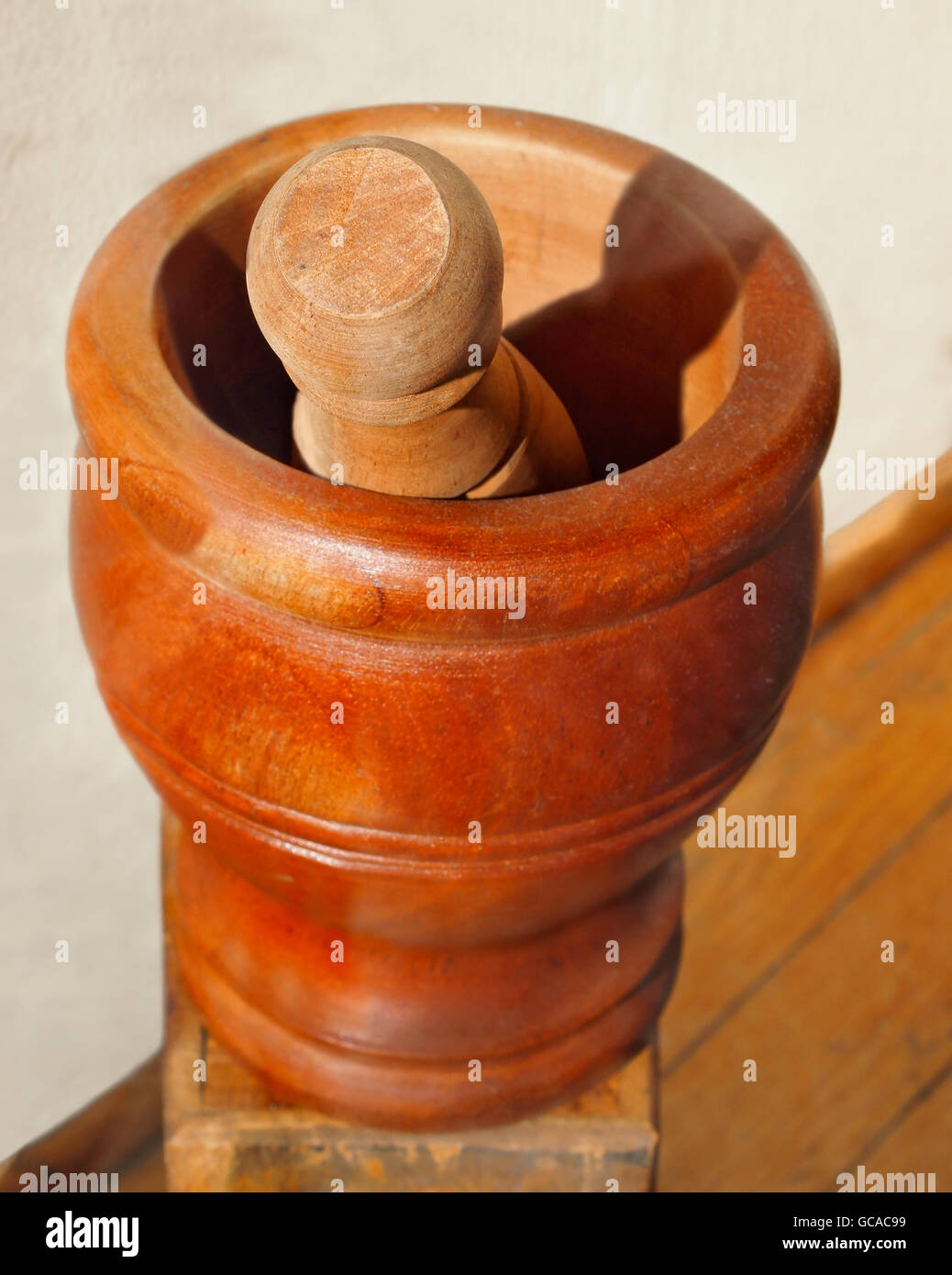 A vintage wooden mortar and pestle from an pharmacy, with copy space. Stock Photo