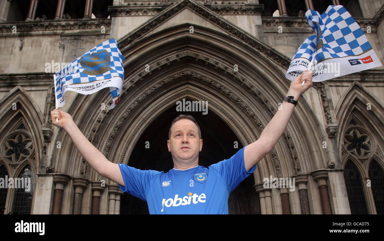 Portsmouth fan David Maples outside the High Court in London as Portsmouth football club face a winding-up petition. Stock Photo