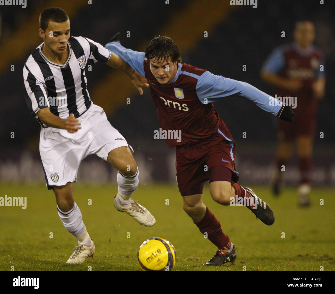 Aston Villa's Ryan Simmonds (right) tussles for the ball with West Bromwich Albion's Ashley Malcolm (left) during the FA Youth Cup 4th Round game. Stock Photo