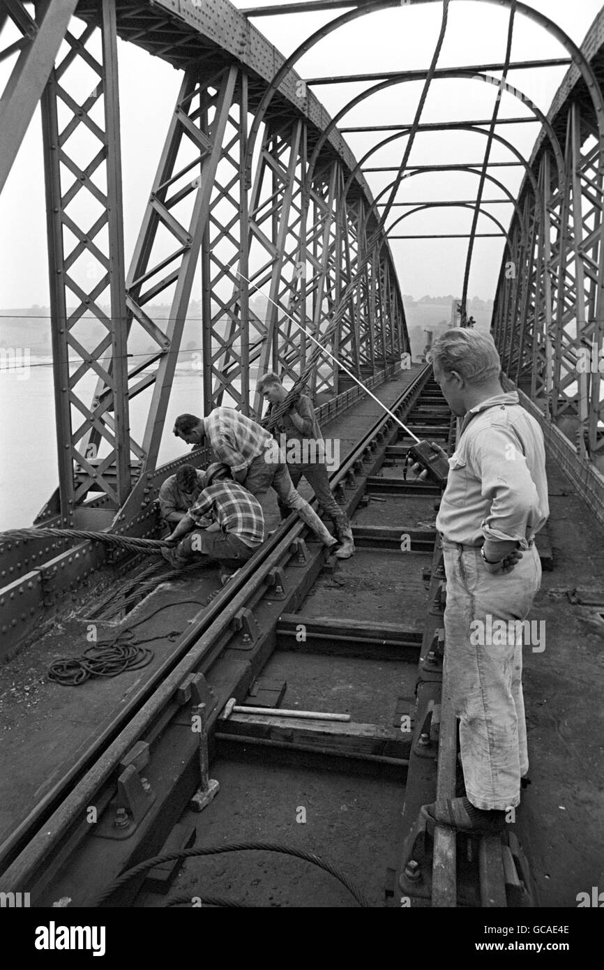 A German expert directs operations with the aid of a walkie-talkie as a sling is fixed on a section of the Old Severn Railway Bridge, which is being demolished. Badly damaged during an major incident in 1960, the bridge has reached the end of it's working life. Stock Photo