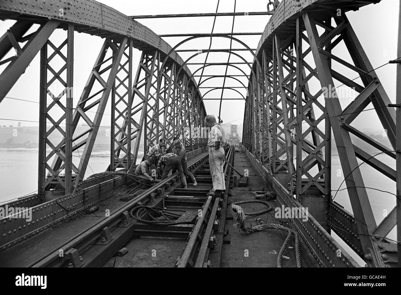 A German expert directs operations with the aid of a walkie-talkie as a sling is fixed on a section of the Old Severn Railway Bridge, which is being demolished. Badly damaged during an major incident in 1960, the bridge has reached the end of it's working life. Stock Photo