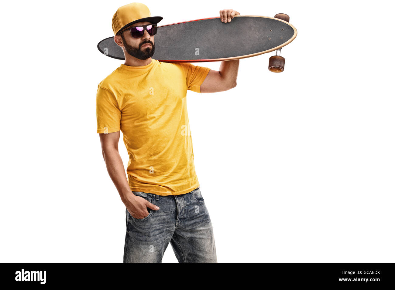 se tv kok jævnt Cool guy holding a longboard over his shoulder and looking at the camera  isolated on white background Stock Photo - Alamy