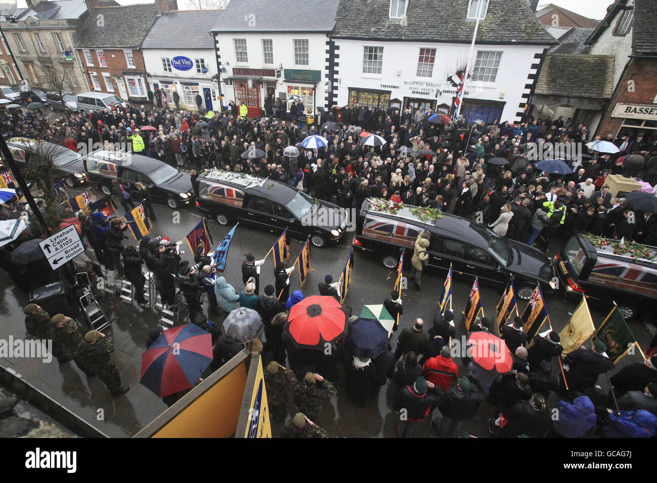 The coffins of five servicemen killed in Afghanistan are driven through Wootton Bassett, Wiltshire. Stock Photo