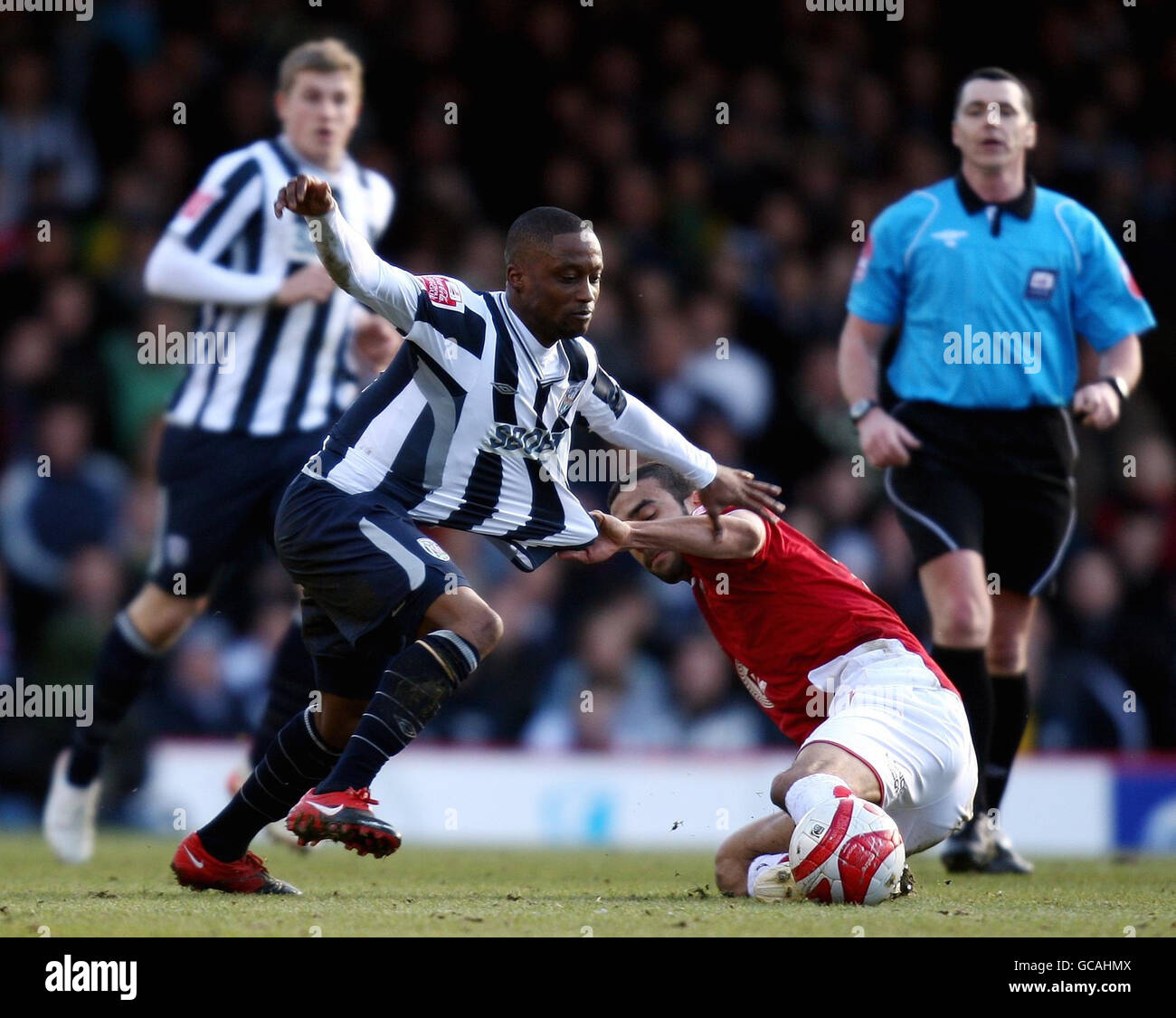 West Brom's Andwele Slory is tackled by Bristol City's Liam Fontaine during the Coca-Cola Championship match at Ashton Gate, Bristol. Stock Photo